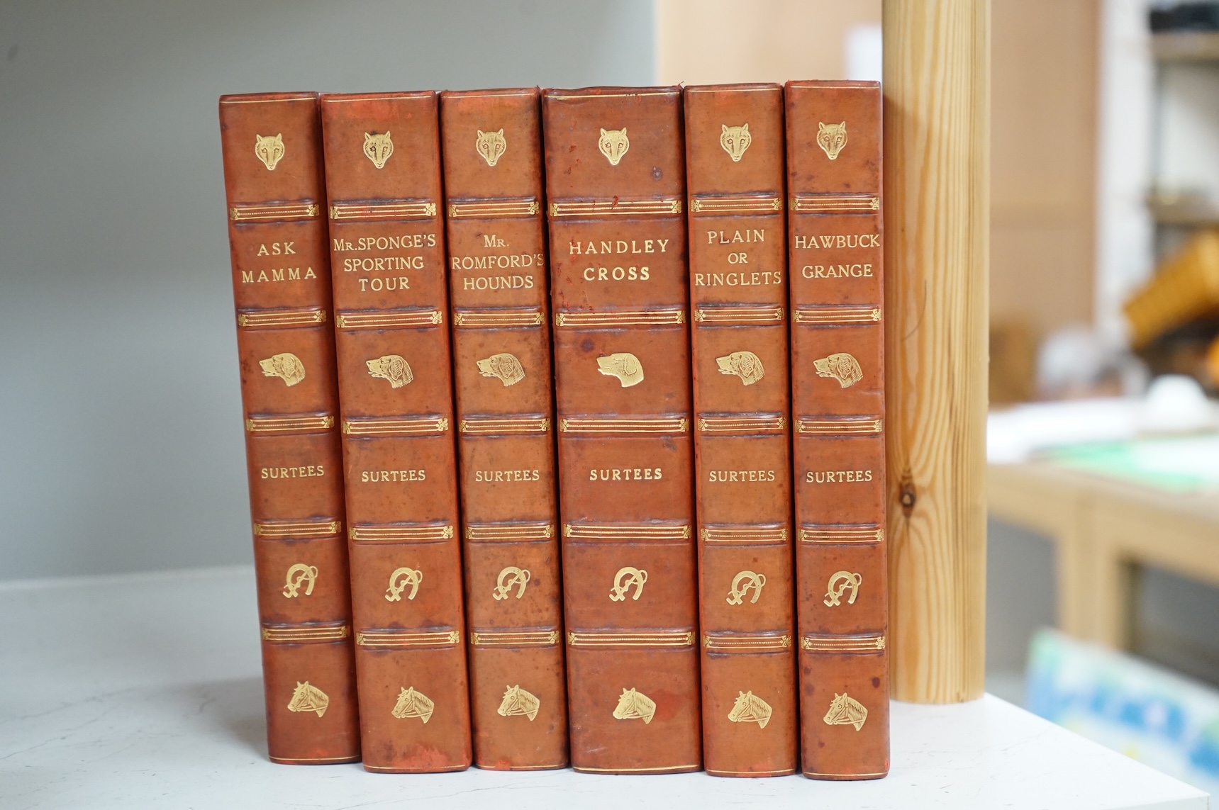 [Surtees, R.S.] Sporting Novels. 6 vols. hand coloured pictorial titles and plates, other text illus.; contemp. red half calf and cloth, gilt pictorial panelled spines, gilt tops and marbled e/ps., med. 8vo. printed for